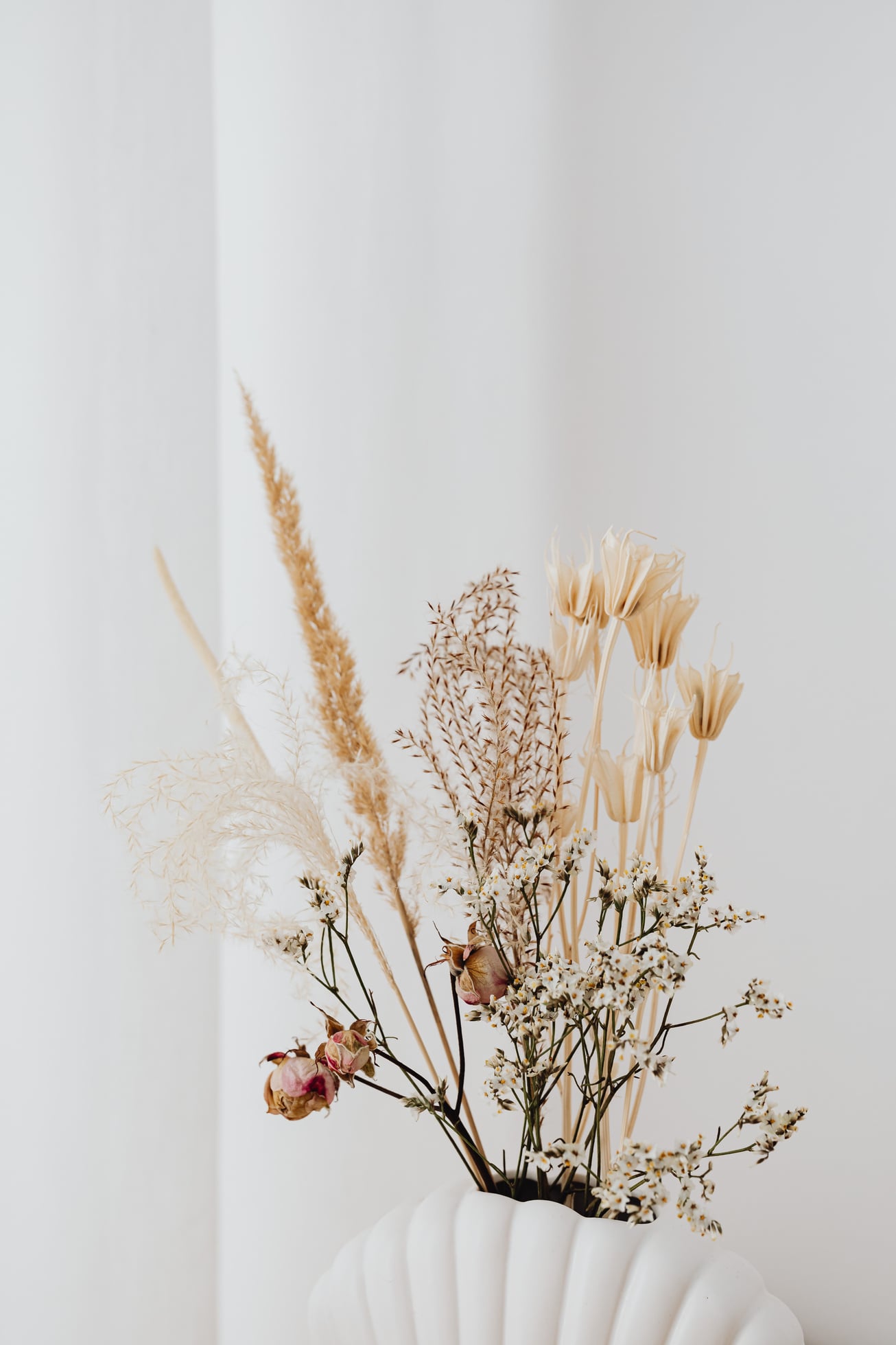 Dried Flowers on White Ceramic Vase